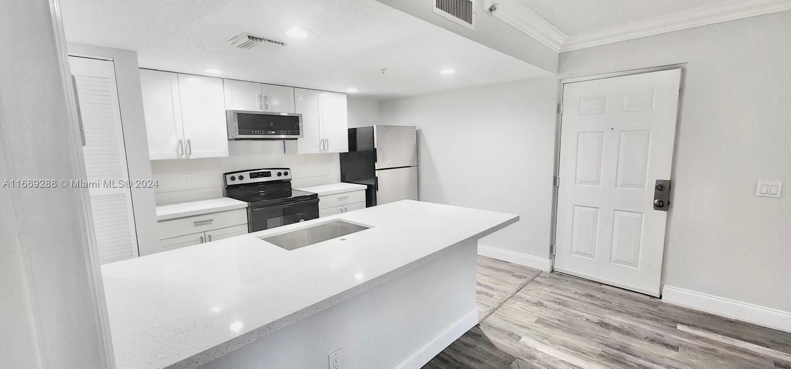 Renovated 1 Bed, Bath Apartment in very nice small community in Tamarac. First floor unit with new Kitchen cabinets with granite countertop, Full bathroom with Tub/shower and modern vanity, Laminate Floors, Washer and dryer inside unit. Very good location within minutes access to major highway Sawgrass Expressway. Great area with many near by shopping centers, Grocery stores and more. Assigned parking.