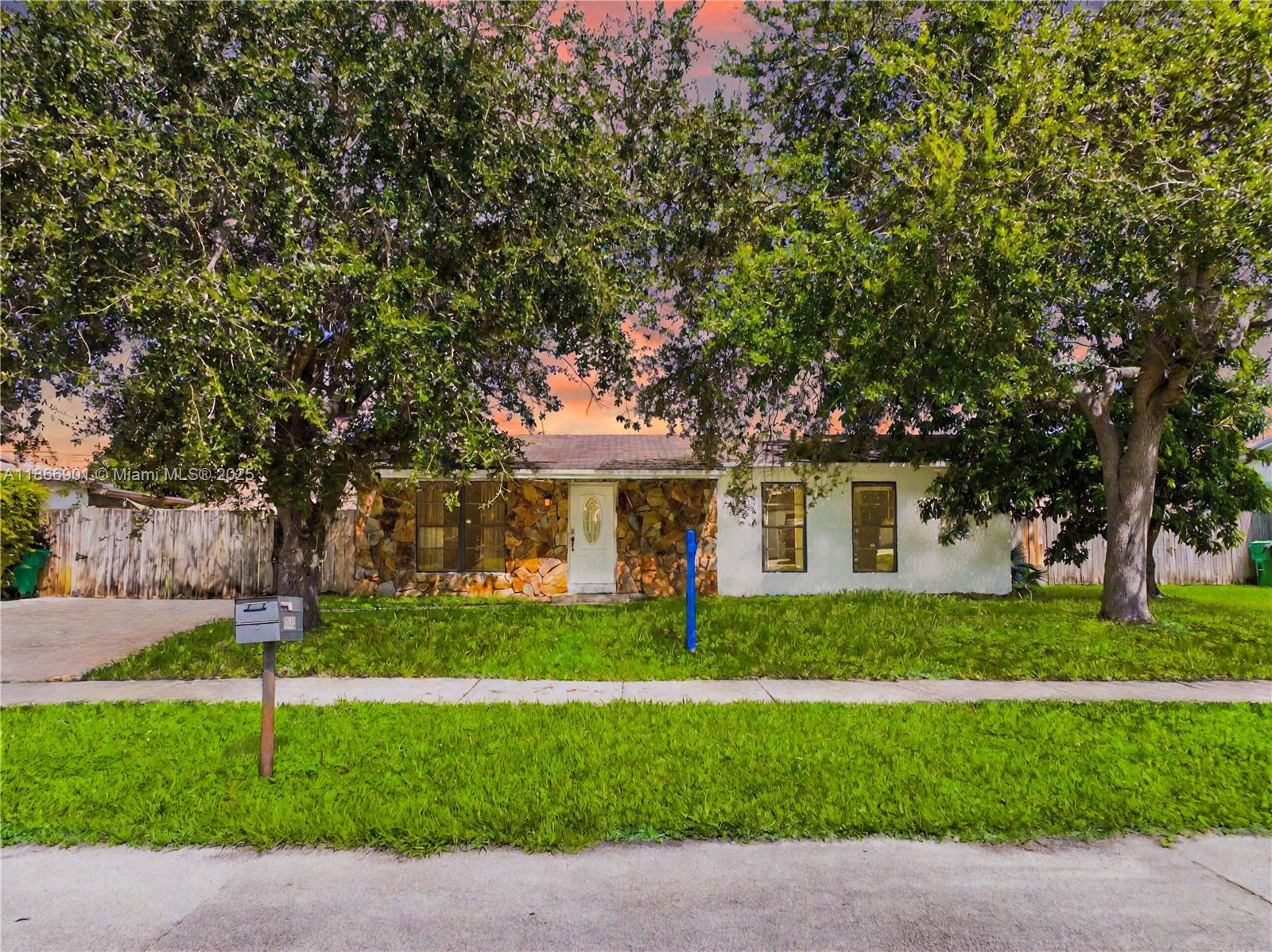 Welcome to this cozy single-family home with 4 bedrooms and 2 full bathrooms in the desirable Meadow Woods community. The open floor plan seamlessly connects the living, kitchen, and dining areas. The spacious family room showcases a stone fireplace, exposed wood-beam ceiling, wood paneling, built-in shelving, and tile flooring, creating a warm, rustic charm. Remodeled master bathroom will be completed before closing. Fully fenced yard offers ample space to park an RV or boat and includes an extra shed for storage. Extended driveway for multiple car parking. No HOA!!! Conveniently located just north of Homestead and close to Miami, with easy access to the Homestead Air Reserve Base, Turnpike, and Black Point Marina. Explore the 3D virtual tour with floor plans. May the Force be with you!