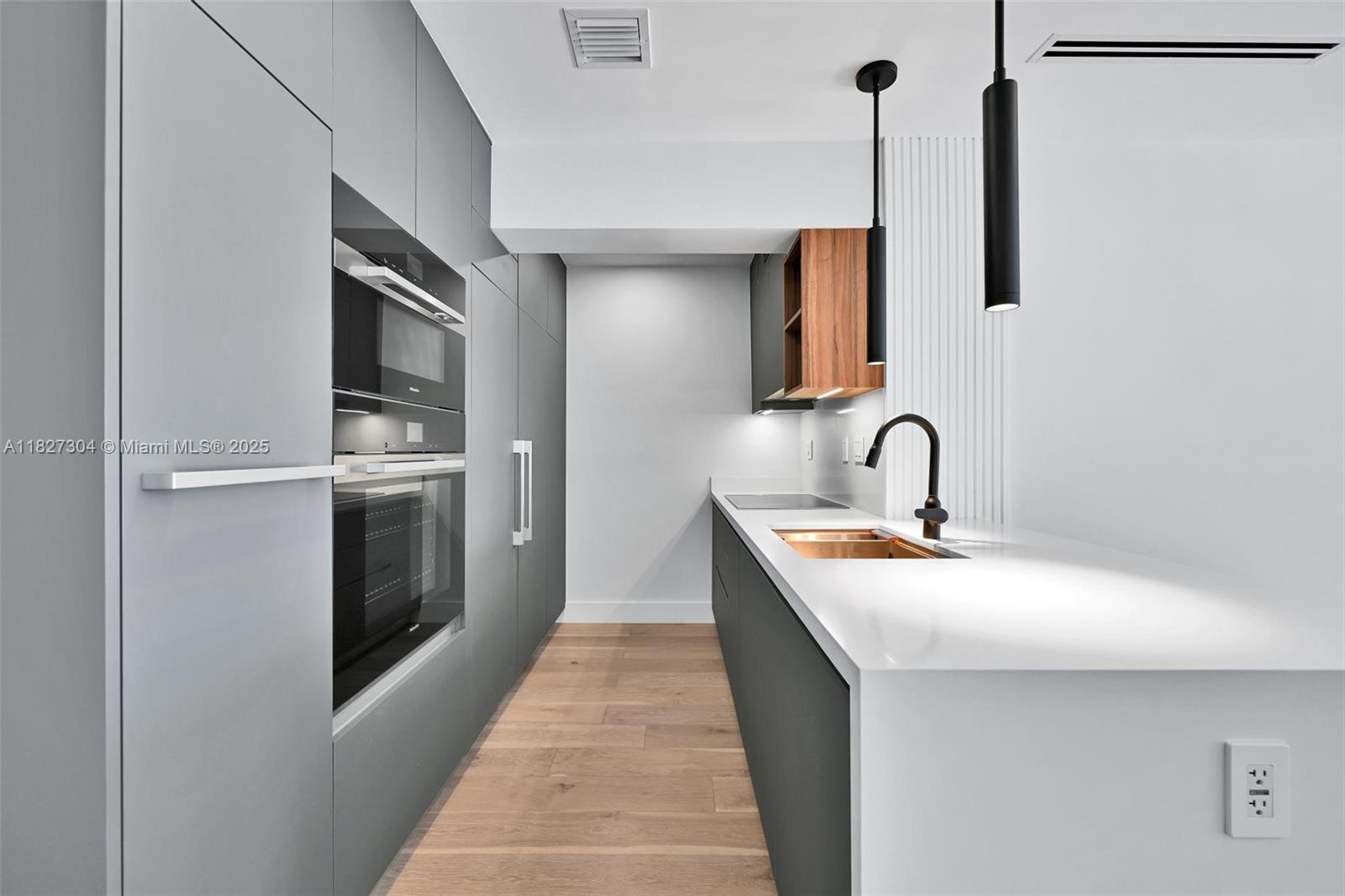This beautifully designed 4-bedroom, 4-bathroom residence offers a rare combination of space, style, and value in the heart of Key Biscayne. With clean architectural lines, premium finishes, and an open, light-filled layout, this home is perfect for families who want room to grow or investors seeking strong demand in a high-end market. The contemporary kitchen is outfitted with Miele appliances, and custom-built closets provide smart storage solutions throughout the home. Each bedroom is generously sized, offering privacy and comfort for every member of the household. An assigned golf cart parking space adds an island-living convenience that Key Biscayne residents love. Move in and enjoy the best of coastal living—close to beaches, parks, schools, and all the charm of village life.