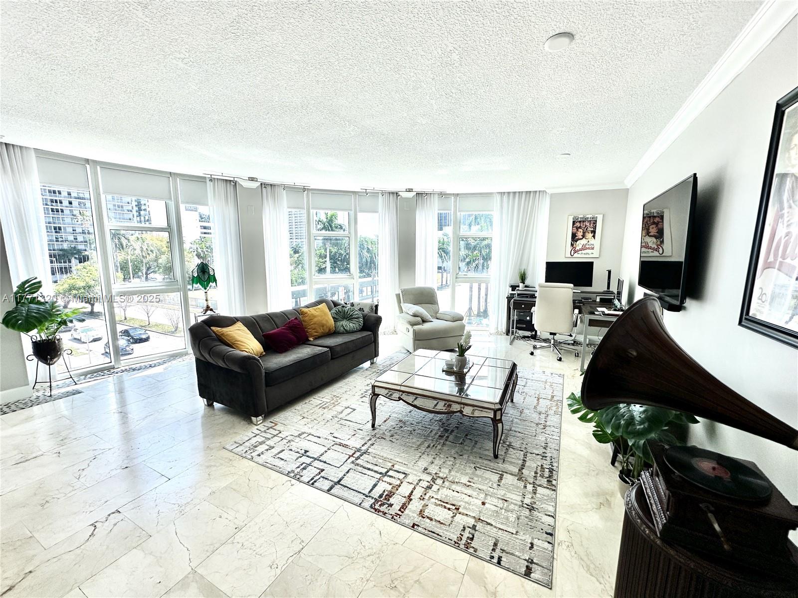Live Elevated — One-of-a-Kind Corner Residence in Edgewater!
Experience the ultimate city lifestyle in the largest 2-bedroom layout at 1800 Biscayne Plaza. Enter through an elegant foyer with marble and laminate wood floors, soaring ceilings, crown molding, and walls of natural light. One of only two residences with a rare, custom floor plan and dramatic bay windows offering stunning city views. Perfectly located just steps from Edgewater’s best and minutes from Downtown Miami. Enjoy parking outside your door, a bayview pool, full gym, and more. Publix is across the street, with Wynwood, the Design District, and the Kaseya Center nearby. Stay active at Margaret Pace Park and explore top dining, culture, and nightlife. This is more than a home — it’s a lifestyle. Don’t miss it!
