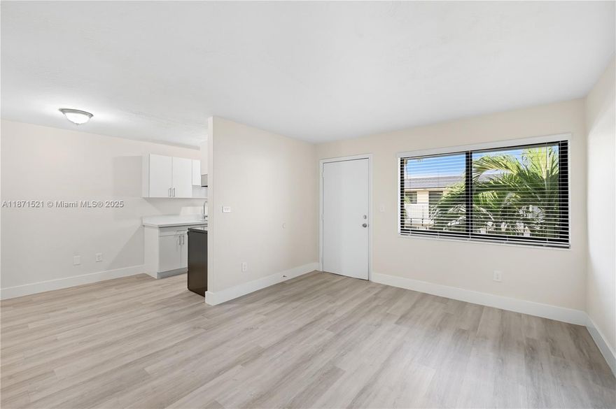 Brand new modern kitchen with quartz countertop and updated bathroom with LED mirror, hurricane impact windows in this charming 1 bed / 1 bath unit has been completely updated and is move-in ready. Enjoy a modern kitchen, modern bathroom, new appliances, updated flooring, and fresh blinds throughout. The space feels bright, clean, and cozy — perfect for comfortable living. The building offers convenient laundry facilities on the first floor and each unit includes one assigned parking space. Centrally located near shops, schools, and major roadways.