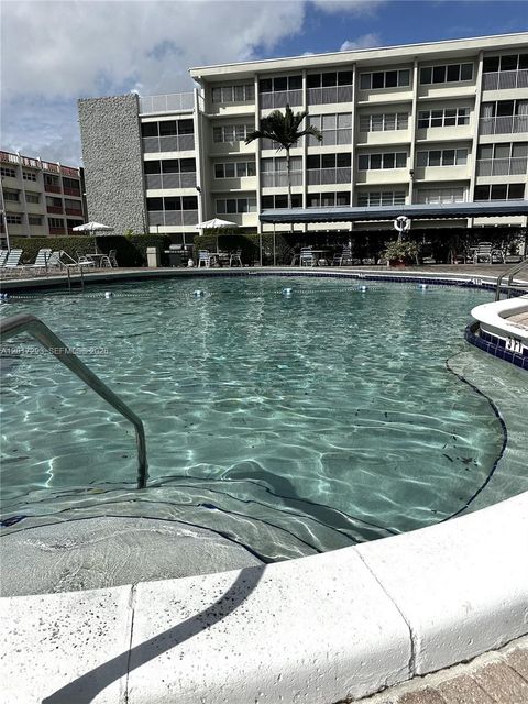 Photo of 410 SE 2nd St #415, Hallandale Beach, FL 33009 (MLS # A12017293)