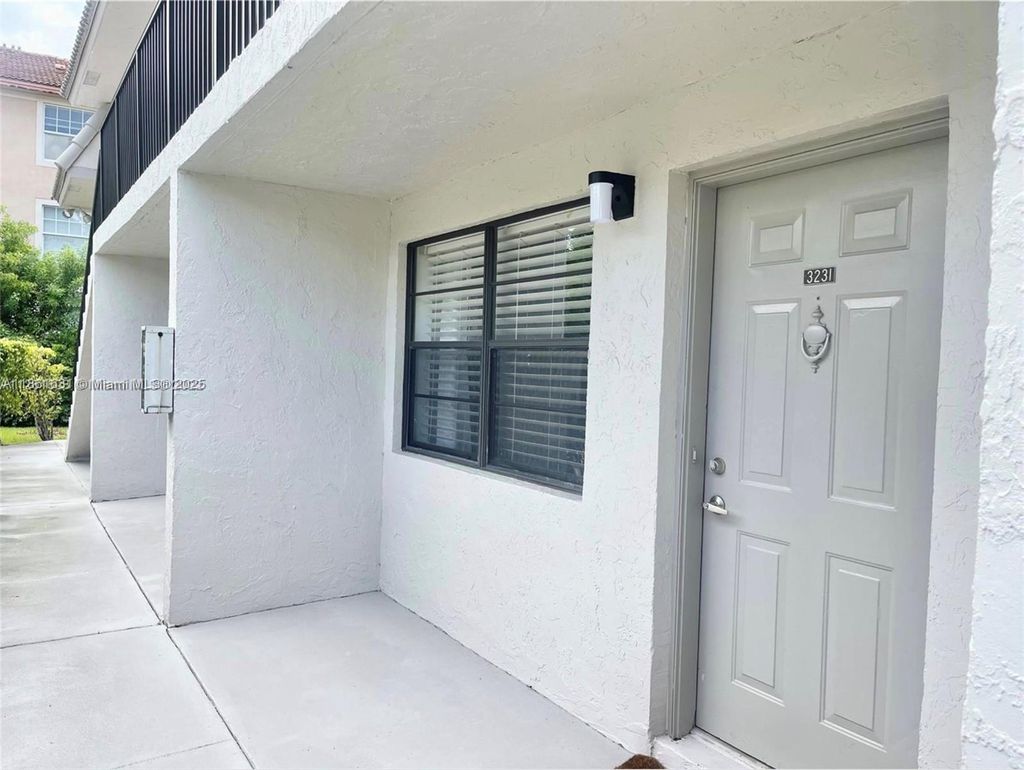 Photo of 3231 NW 102nd Ter #3231, Coral Springs, FL 33065 (MLS # A11861631)