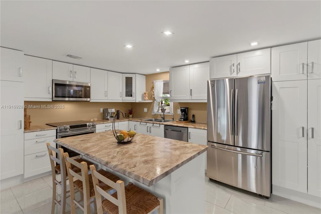 Photo of 5239 NW 3rd Ave, Deerfield Beach, FL 33064 (MLS # A11916928)