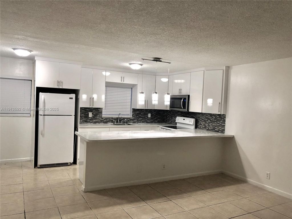 Photo of 2521 Pierce St #3, Hollywood, FL 33020 (MLS # A11912592)