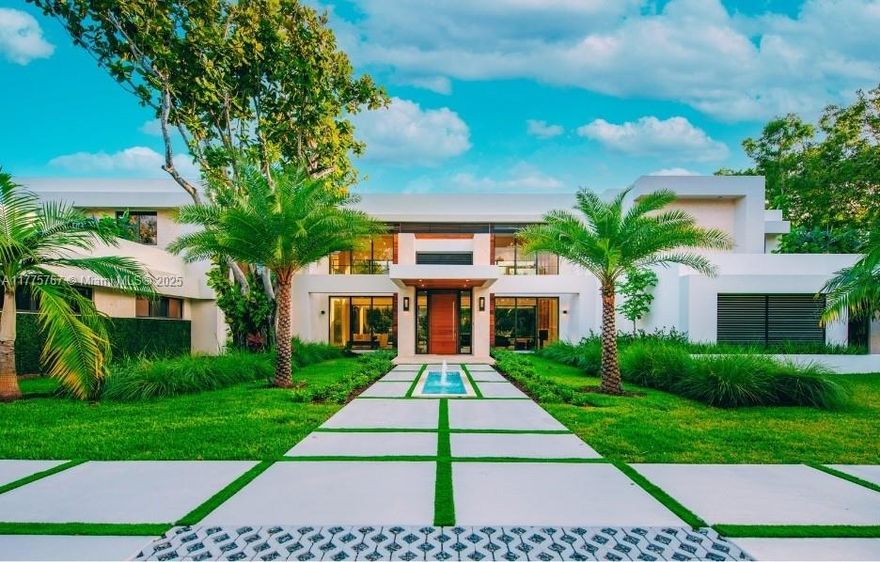 RELISTED TO SELL - Nestled on a tranquil road in desirable North Pinecrest, this stunning modern residence sits on a sprawling .88 acre lot. With 22' high ceilings, the spacious 2-story floor plan is flooded with natural light, creating a bright and airy ambiance. Additional features are: living room, 2 family rooms, a formal dining room, an office-gym, a 4-person elevator, and a home theater, this residence is the epitome of luxury living. The exterior includes expansive covered terraces, complete with an outdoor BBQ, perfect for entertaining guests. With ample parking available, you can host family and friends with ease. This exceptional property is READY NOW