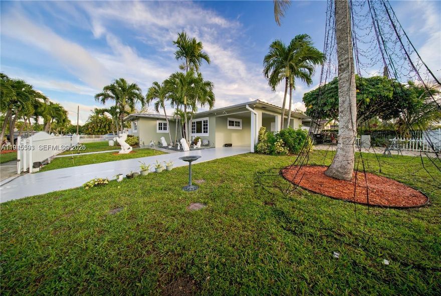 Beautiful corner property with 3 bedrooms & 2 bathrooms, metal roof, impact windows, security system, electronic gates, and two independent entrances. Spacious yard with fruit trees (papaya, guanabana, guava, peach, avocado, lemon, sapote, mango, carambola) and room for a garden. Ample parking for multiple vehicles, RVs, or boats + two storage units. Must see!!