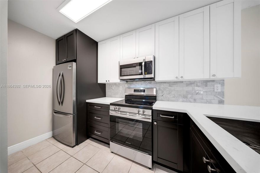 BACK ON MARKET ! Beautifully renovated 3-bedroom corner unit with private entrance located in a desirable gated community. This spacious first-floor condo offers 3 bedrooms, 2 fully updated bathrooms, and a bright open layout perfect for comfortable living and entertaining.
The modern designer kitchen features new quartz countertops, two-tone shaker cabinetry, and brand new stainless steel appliances (Best Buy warranty included). Additional upgrades include new bedroom flooring, tankless water heater, and new roof. Enjoy the convenience of in-unit laundry and low-maintenance living.

Community amenities include tennis courts, clubhouse, fitness center, two swimming pools, hot tub, playground, and 24-hour security.

Ideally situated near top-rated schools, shopping centers, dining, and major highways. Move-in ready and investor-friendly — may be rented immediately.