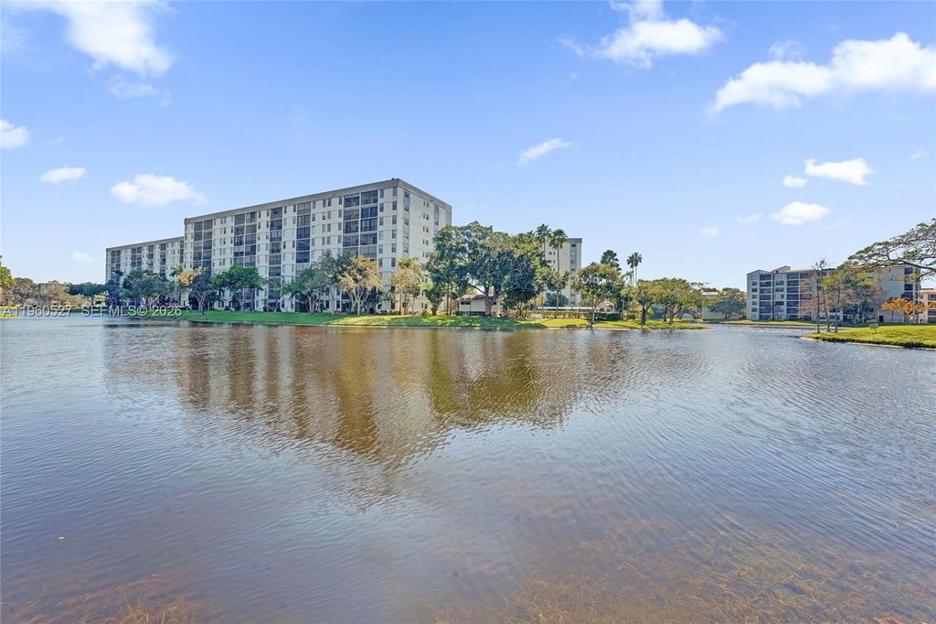 Photo of 2228 N Cypress Bend Dr #103, Pompano Beach, FL 33069 (MLS # A11960527)