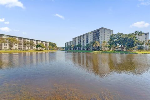 Photo of 2228 N Cypress Bend Dr #103, Pompano Beach, FL 33069 (MLS # A11960527)