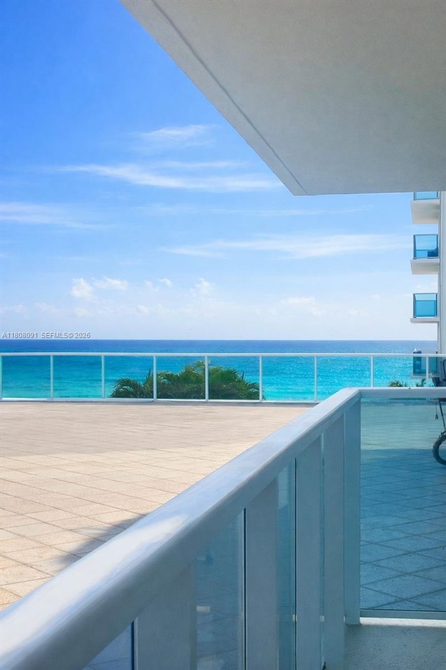 Motivated seller! Fantastic opportunity to own a fully remodelled 2-bed, 2-bath villa-style corner unit in Aquarius with 1,768 sq ft of living space and direct walk-out access to the sunset pool deck and gym, no elevator needed! This spacious unit features a custom kitchen, modern baths, porcelain floors, impact windows, motorized shades, a smart thermostat, and comes fully furnished—assessments paid in full. Garage parking included. Resort-style amenities: 2 pools, oceanfront BBQ, on-site restaurant, fitness center, valet, and 24/7 security. Steps from Hollywood Beach. Easy to show!