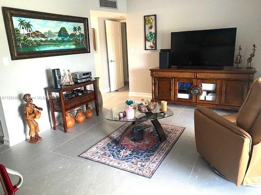 Remodeled, spacious unit at Sabal Palm Village in Tamarac. New kitchen with stainless steel appliances, bathroom and new ceramic tile flooring. Pleasant view of pool area and green spaces. This 55+ community has wonderful amenities that include a fitness room, BBQ, tennis, heated pool, library, and more... It is conveniently located close to shopping, restaurants, and the Turnpike.