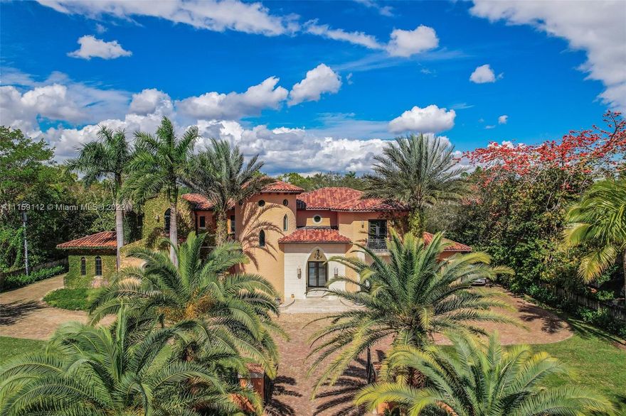 Gated 'MOROCCAN MEDITERRANEAN' Acre Estate on Montgomery Drive - Chicago Brick Courtyard w/side Porte Cochere & 3 car gar (lift suitable) Stately Foyer & Living Rm w/Floor to Ceiling Moorish Designed Window Overlooking Verandas, Pool, Spa & Summer Kitchen - Marble & Brazilian Cherry Floors - Custom Wood Wine Room & Formal Dining Gourmet Granite Kitchen & Buffet w/ Dacor Gas Stove Opens to Large Family Room w/ Stone Fireplace - Elevator - 1st Floor > 2 En Suite Bedrooms, Game Room & Laundry Room Sweeping Marble Stairway to Primary Bedroom Suite w/Balcony & Custom Closets. Onyx Vanity w/Sheryl Wagner Fixtures & Stone Shower - 2 Additional En Suite Upstairs Guest Rooms w/Treetop Views - Designer Millwork & Elaborate Ceilings - Put Your Touches on This Pinecrest Beauty & Resort Lifestyle .