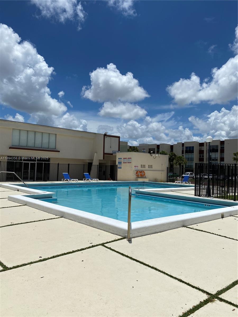 Central located unit ready to move in, great condition. 2/2 + den on the first floor, very well maintained and great condition washer and dryer inside the unit. Hurricane accordion shutter. This gated community offers: pool, tennis, basketball and playground. Located near Florida International University (FIU), schools, Dolphin mall, shopping centers & public transportation.
