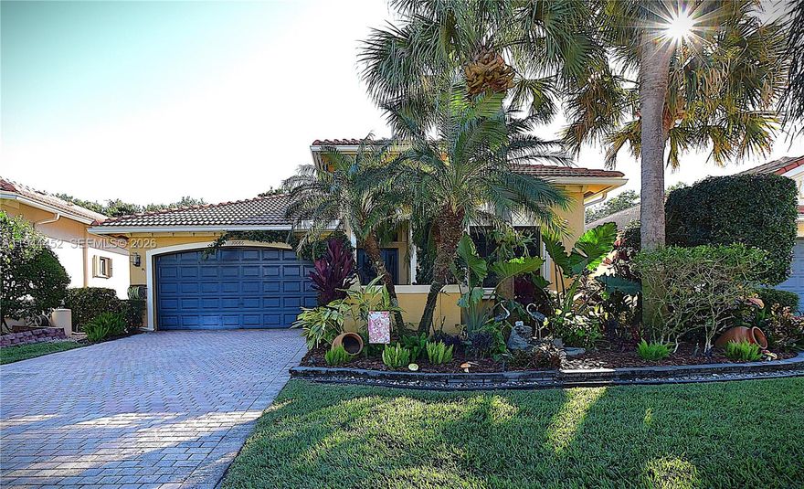 This beautifully updated 3-bedroom home in Tivoli Lakes greets you with a spacious open floor plan, a charming foyer, and lush landscaping surrounding the front, sides, and back. The counter-height, eat-in kitchen includes a built-in desk, while 11-foot ceilings with crown molding run throughout the home, complemented by a stunning tray ceiling in the master bedroom. The kitchen and second bathroom have been stylishly renovated, and the electric fireplace features stonework extending to the ceiling. Fixtures, window treatments, and chandeliers have all been thoughtfully updated. The garage offers an epoxied floor and added stylish cabinets for organized storage. The master bath boasts two fully built-out walk-in closets. Out back, enjoy a screened-in patio surrounded by tropical greenery. Tivoli Lakes is fully fenced with a 24-hour manned security gate and offers amenities including a theater, grand ballroom, fully equipped gym, pickleball and clay tennis courts, billiards and card rooms, a heated pool, jacuzzi, shuffleboard, and more. Conveniently close to beaches, the Turnpike, and I-95.
Flooring updated in 2021 along with new baseboards and crown molding. Kitchen full remodel 2023 with Quartzite countertops. Storage in built ins, MB Closets, Office reading nook, garage cabinets and epoxy flooring done in 2021. Custom window treatments and blinds done 2023.

Please be sure to click on 360Degree link for a virtual tour of the home online.