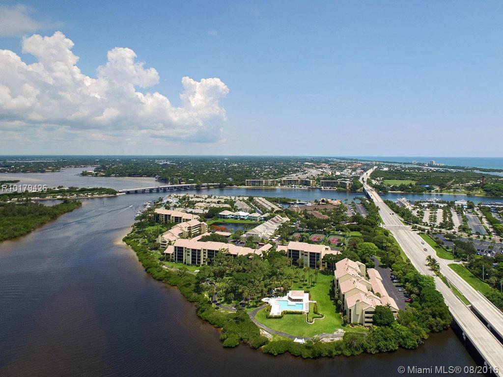 SPECTACULAR INTRACOASTAL VIEWS FROM A MOST DESIREABLE END UNIT ON THE TOP FLOOR. THIS CONDOS IS EXCEPTIONALLY LARGE WITH 2+BEDROOMS PLUS DEN, 2.5 BATHS, HIGH VAULT CEILING, FIREPLACE, 2 TERRACES: ONE BALCONY IS OPEN WITH ACCESS FROM UPDATED KITCHEN AND DINING AREA. THE EXTRA LONG SCREENED PORCH OFFERS BEAUTIFUL WATER VIEWS AND BREEZES. UPGRADES GALORE WITH SPLIT BEDROOMS, WORKING FIREPLACE, WET BAR, TILED FOYER. LARGE LAUNDRY ROOM WITH STORAGE. PRIME PARKING NEAR ELEVATOR. CARPORT W/STORAGE ROOM, TENNIS