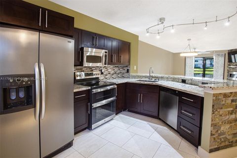 Photo of 2213 Cypress Island Dr #102, Pompano Beach, FL 33069 (MLS # A11796119)