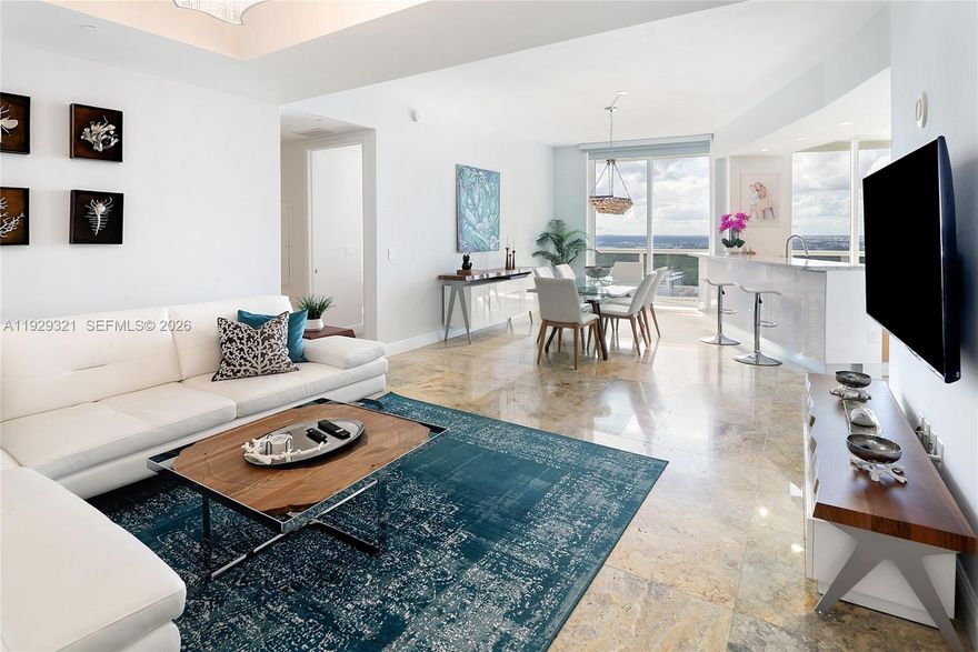 Luxuriously upgraded with stunning 30th-floor panoramic skyline views from sought-after Tower I, this exceptional 1,435 SF (133 m2) residence plus a 450 SF terrace with private access from every room is designed for seamless indoor-outdoor living, featuring floor-to-ceiling glass and soaring 10’ ceilings. The remodeled open layout is filled with natural light from dual exposures to the living room. It showcases a chef’s eat-in kitchen with granite countertops, Italian custom cabinetry, and premium Sub-Zero, Wolf, and Bosch appliances. Soft contemporary finishes, recessed lighting, and designer fixtures elevate the space throughout. The spacious primary suite features a beautiful ensuite bath and walk-in closet. Move-in ready, with a negotiable furniture package. Living at Trump Tower also means enjoying resort-style amenities every day at your doorstep with direct access to the beach, a world-class wellness center, a relaxing Spa (steam/sauna), a beachfront restaurant, a heated pool, a hot tub, a business center, 24-hour services, and Valet. This is a lifestyle of comfort and effortless coastal living. Located minutes away from Bal Harbour shops, Aventura Mall, and the best of South Florida, including incredible restaurants and entertainment, and adjacent to Haulover Park. Schedule your private showing today and make this stunning beachfront retreat yours!