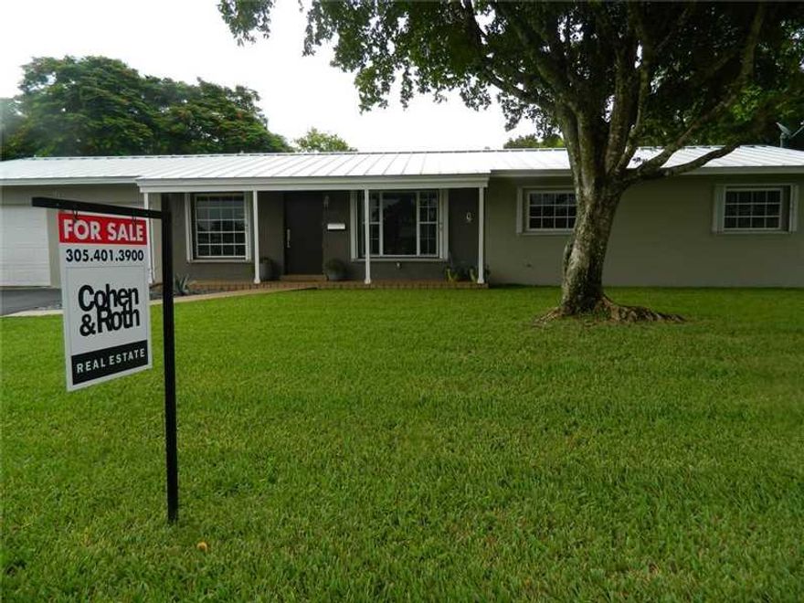 Recently updated on oversized lot. New open kitchen with Miele appliances (sub zero fridge) and wood cabinets. New (fully permitted) electrical system. Air conditioning system with insulated ducts and new attic insulation. Tastefully stained concrete floo r throughout. Dade-County-approved accordion shutters. New metal roof (installed 2014.) High hats with energy efficient high hats throughout. Large open back yard with screened-in porch. Not a short sale nor foreclosure. Plenty of room to add on.