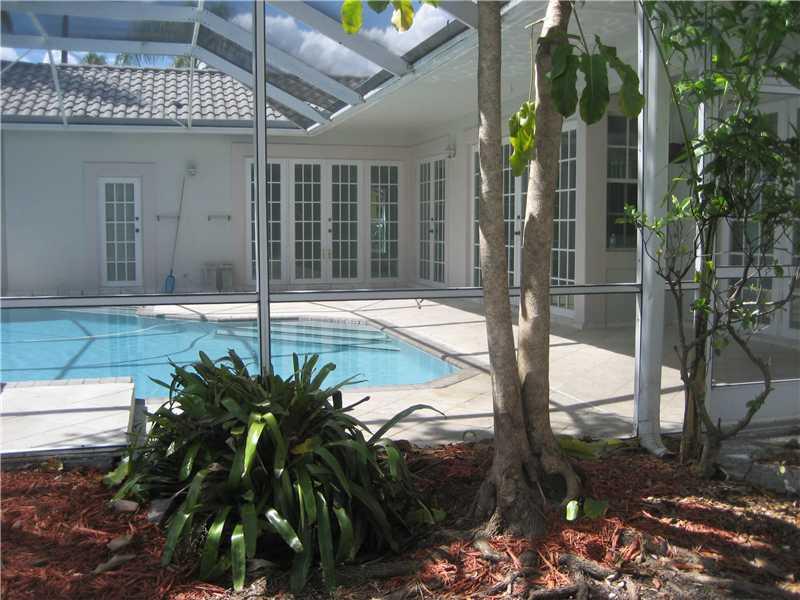 Charmimg Lake front home in sought after Laguna Springs in Weston. Screened in Pool surrounded by lush landscaping overlooking the lake. 2 bedrooms upstairs and master bedroom downstairs. Large living & open areas with formal dining , family room , livin g room. French doors open up to pool area large patio great for entertainments. 2 car garage. Near schools, major highways , gated community. New A/C. Tenant moving out. Cant be shown until the 21st of June.