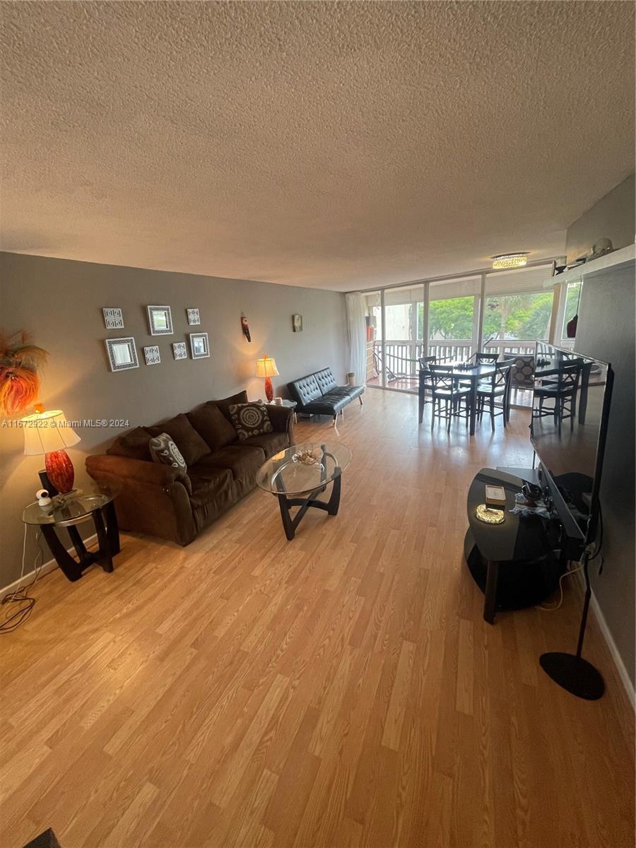 BELOW MARKET PRICE! BRING AN OFFER! Welcome to this spacious and move-in-ready 2-bedroom, 2-bathroom corner condo at Environ in Lauderhill! Enjoy added privacy in this pristine unit, featuring an expansive balcony with shutters—perfect for morning coffee or evening relaxation. The building is financially sound with reserves, meaning no upcoming assessments and ease for buyers looking to finance. 680 Credit score and income of $40,000/owner or $60,000/family.
This turnkey condo comes with two parking spaces, including a corner covered spot for larger vehicles, and offers the convenience of a guard-gated entry and a secure lobby. Perfect for singles or families, this clean and move-in-ready unit is waiting for you!