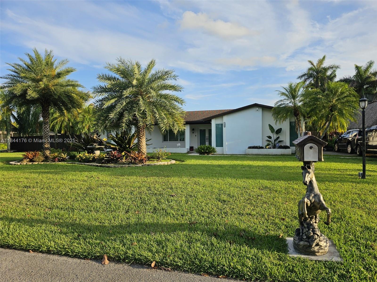 Beautiful home located in sought after REDOVO , with a pool, laundry room, huge terrace, large yard, kitchen pantry, and a real fireplace. This charming, country-style home is situated on a 1/2 acre lot with ample closet space. It features porcelain tiled flooring and impact windows throughout. Located in a beautiful and very quiet neighborhood with great schools, it is close to Key Largo, Key West, Homestead Bay front Park and Marina, Turkey Point, and Homestead Military Base. There is no association. This property will not last long. Please call listing agent for showing instructions.