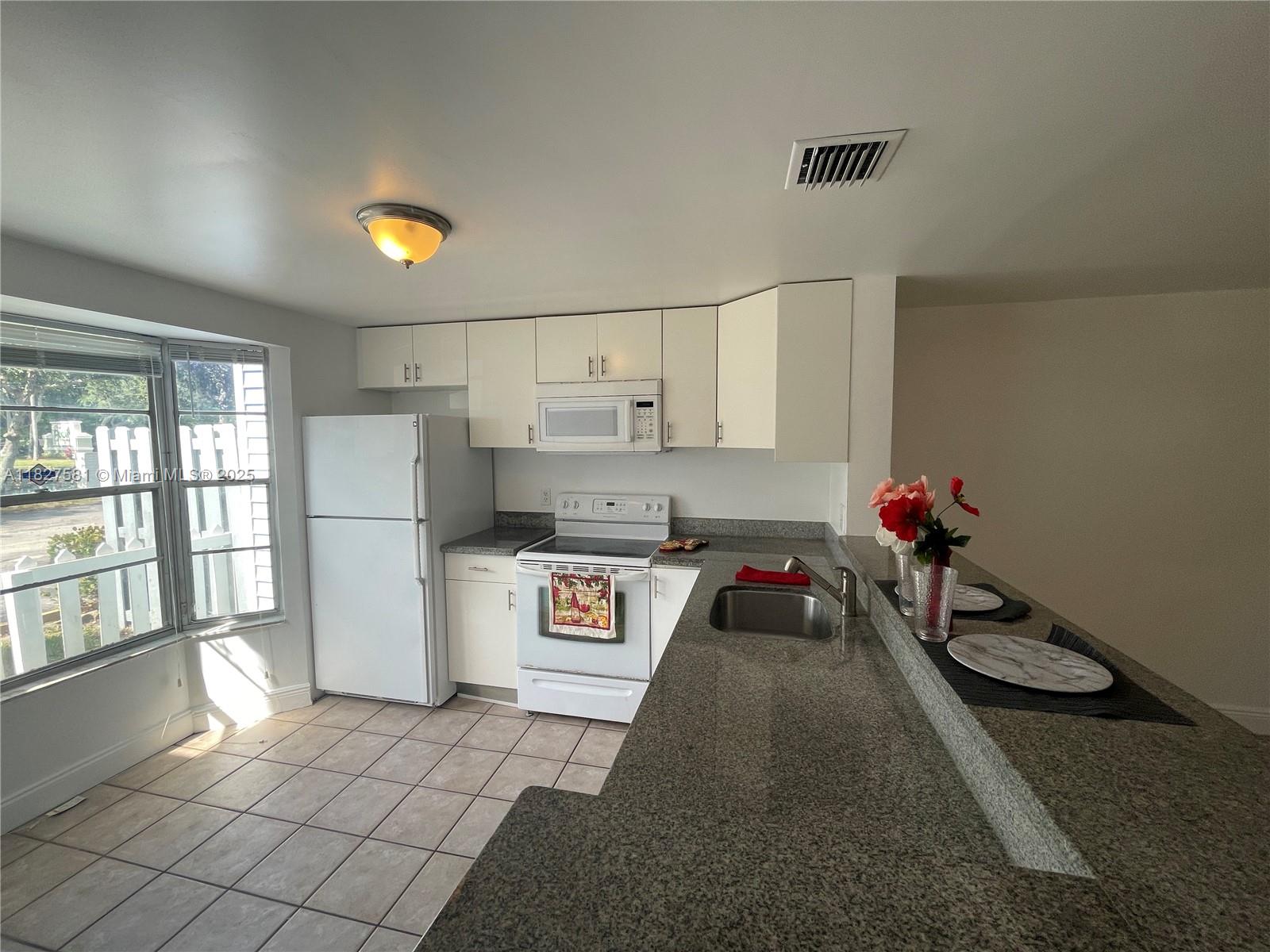 VERY SPACIOUS 2 BEDROOM 1.5 BATH TOWNHOME WITH OPEN FLOOR PLAN, GRANITE COUNTERS, WASHER/DRYER IN UNIT, TILE FLOORS THROUGHOUT, AND FENCED-IN PRIVATE PATIO. CLOSE TO MAJOR ROADS AND HIGHWAYS, SHOPPING AND DINING. WATER/SEWER IS INCLUDED IN RENT. ONE PET ALLOWED, NO SIZE RESTRICTIONS, NO AGGRESSIVE BREED - $250 NONREFUNDABLE FEE APPLIES. FIRST AND LAST MONTH RENT PLUS ONE MONTH FOR SECURITY DEPOSIT REQUIRED TO MOVE IN.