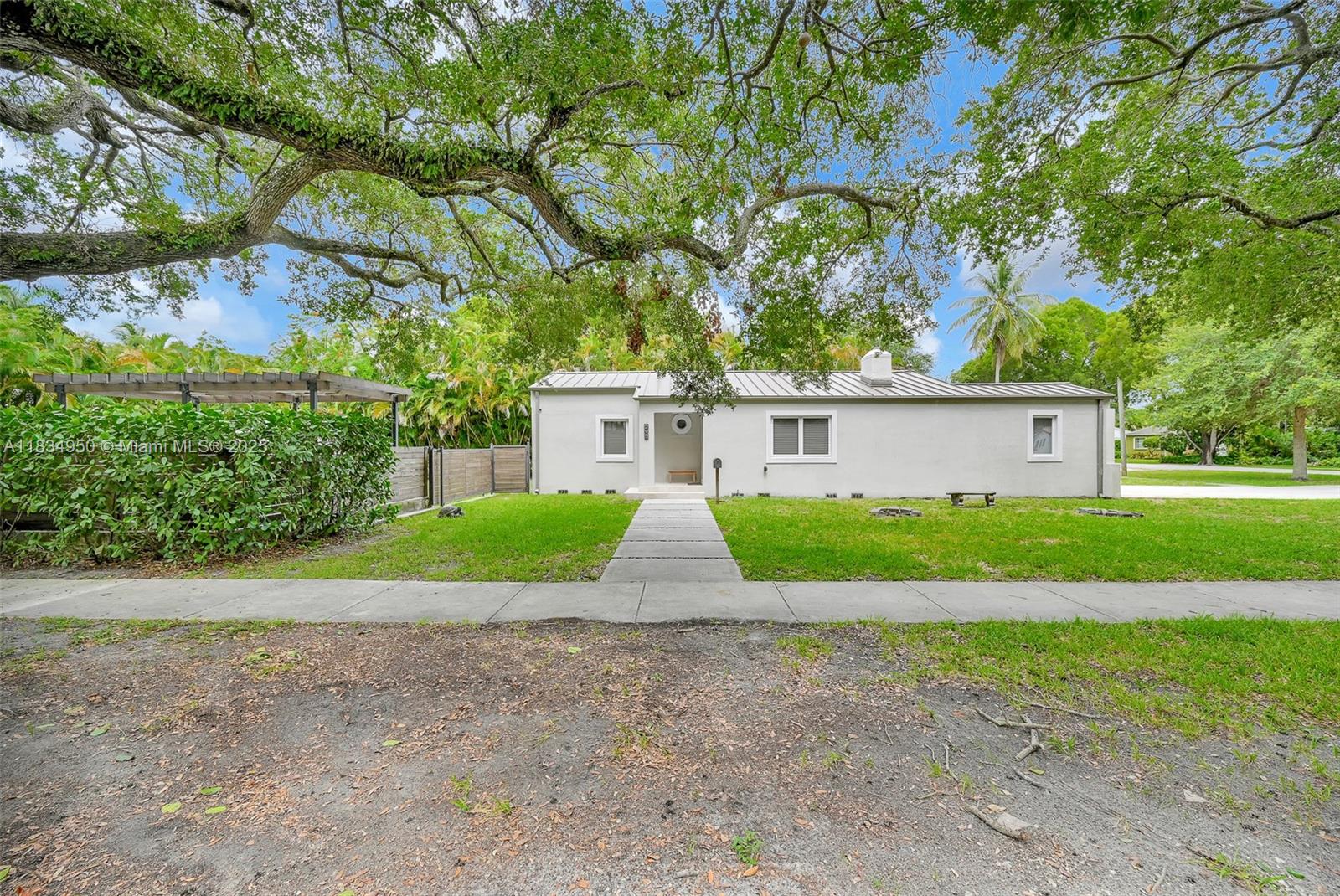 Completely renovated Miami Springs gem on a spacious 11,175 sq ft corner lot! This 3-bedroom, 2-bath home features a recently replaced metal roof, impact windows and doors, and modern finishes throughout. The beautifully converted carport offers flexible space perfect for an office, guest room, or play area. Enjoy a sleek kitchen with updated cabinetry and appliances, renovated bathrooms, and bright, open living areas. Plenty of room to entertain indoors and out. A rare opportunity to own a move-in ready property in one of Miami’s most desirable neighborhoods! AS PER OWNER, THE LIVING AREA SQUARE FEET SHOULD BE AROUND 1600 SQFT DUE TO THE ADDITION
BUT THE CITY HAS NEVER UPDATED THE SYSTEM