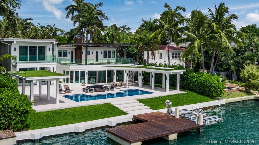 This modern waterfront on the coveted Venetian Islands offers breathtaking wide bay views from a rare lot & a half! Newly renovated and reconstructed, 327 E Rivo Alto welcomes you with a privacy wall and a picturesque courtyard setting. The sleek residence incorporates double height ceilings, an open flow, telescopic doors that maximize light - all the things that embody Miami Beach modernism.The palatial primary suite features a glass enclosed wet room, generous dressing room, and a beautiful balcony. Wake up to Ocean breezes & Sunrises, take a spin on the boat from your dock on 90FT of the Biscayne Bay, and host with pride. With a 3 car garage, this home is primed and ready for all the toys to epitomize Venetian Island living. Just minutes from the chic Sunset Harbour neighborhood too!