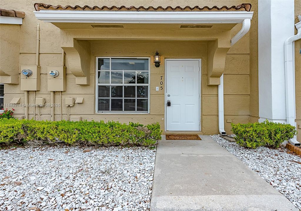 Photo of 705 SW 122nd Ave #705, Pembroke Pines, FL 33025 (MLS # A11843214)