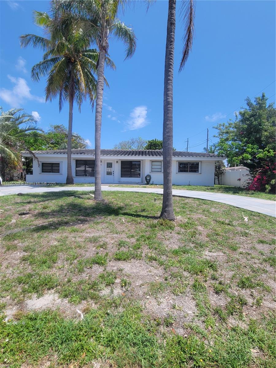 Discover this charming 3-bedroom, 3-bathroom home in East Boca Raton, ideally situated near the beach, restaurants, shops, and FAU. Families will appreciate access to A-Rated Schools! The home features a spacious kitchen and tile flooring throughout the living areas, with wood floors in the bedrooms. Outside, a spacious multi-car driveway provides ample parking. The generously sized, fenced yard includes a storage shed and plenty of room for both children and pets to play.