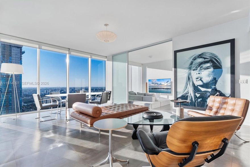 Rare high-floor corner residence at Ten Museum Park, one of Downtown Miami’s most architecturally iconic boutique towers by Chad Oppenheim. This 2BD/2.5BA unit offers approx. 1,123 SF of well-designed living space with floor-to-ceiling glass and sweeping wraparound views of Biscayne Bay, Museum Park, and the Downtown skyline. The open layout is filled with natural light and features sleek ceramic flooring, a modern kitchen that flows seamlessly into the living and dining areas, and true corner exposure for an airy, elevated feel.

The spacious primary suite enjoys bay views and a private retreat-like setting, while the second bedroom is ideal for guests, a home office, or flexible live-work use. Two assigned parking spaces, doorman, and secured lobby access add convenience and peace of mind.

Ten Museum Park is known for its intimate, boutique lifestyle and exclusive amenities including access to Clinique La Prairie Spa, fitness facilities, and Bentley Beach Club membership. Ideally located directly across from Museum Park and minutes from Miami Worldcenter, Edgewater, PAMM, Frost Science Museum, and major Biscayne Boulevard retail and cultural expansion. A strong option for end-users, second-home buyers, or investors seeking a premier bayfront asset in a rapidly evolving urban core.