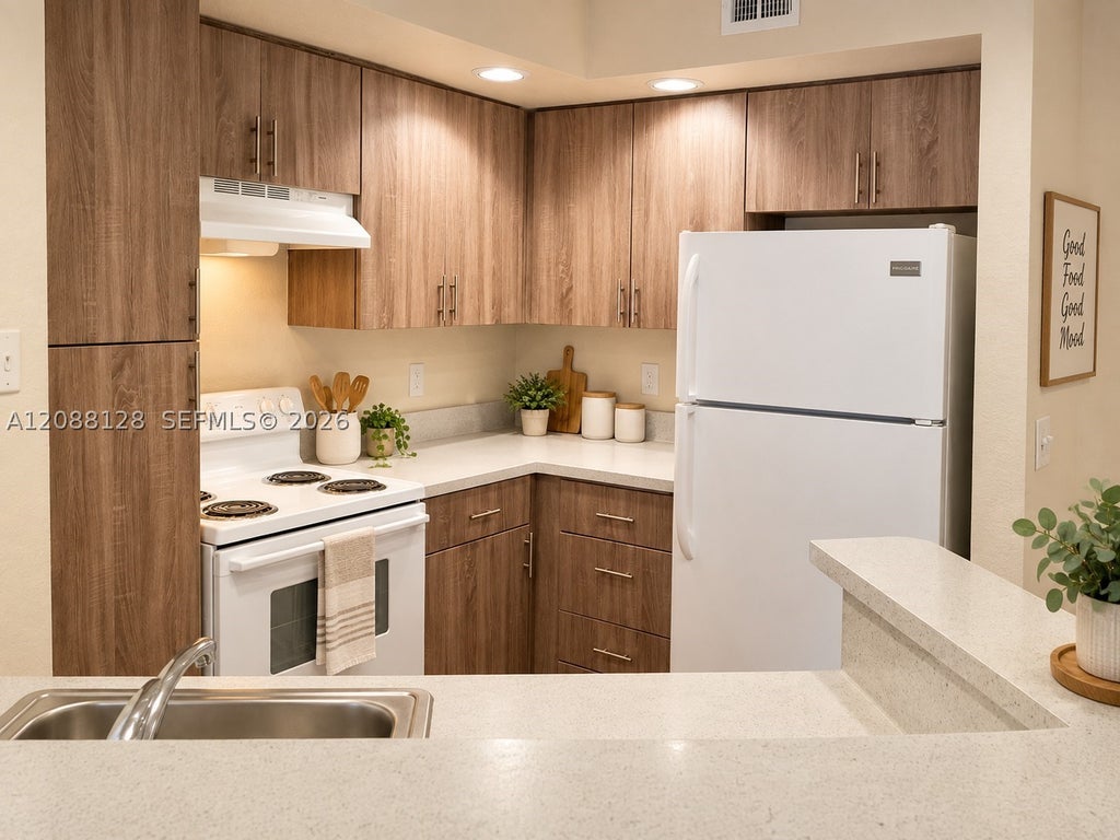 Photo of 12620 Vista Isles Dr #1014, Sunrise, FL 33325 (MLS # A12088128)