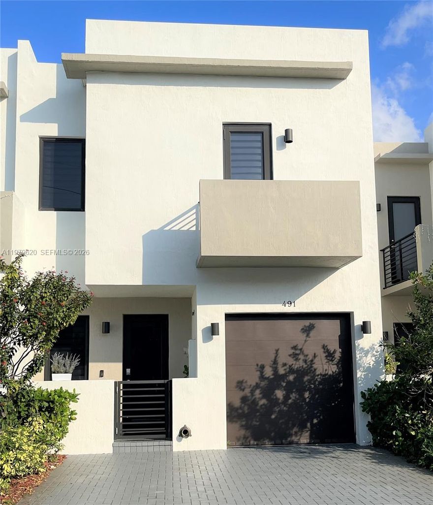 Modern, Open, Carefree living, a rare 4 bedroom 3 and a half bath, located in Century Park Place. Gain access with a keyless entry system and Ring doorbell. The many features include: The Kitchen has a generous amount of counter space, white cabinets, quarts counter tops, stainless steel appliances. The separate laundry room houses a washer and dryer. Impact window and doors. All the bedrooms are upstairs: Primary Bedroom has an en-suite bathroom with double sinks and walk-in closet. The second (Jr. Suite) has its own bathroom and balcony. The spacious fenced private patio is perfect for relaxing or entertaining. There is plenty of parking: a one car garage and space for two other cars right in the drive. This is the best value in the complex.