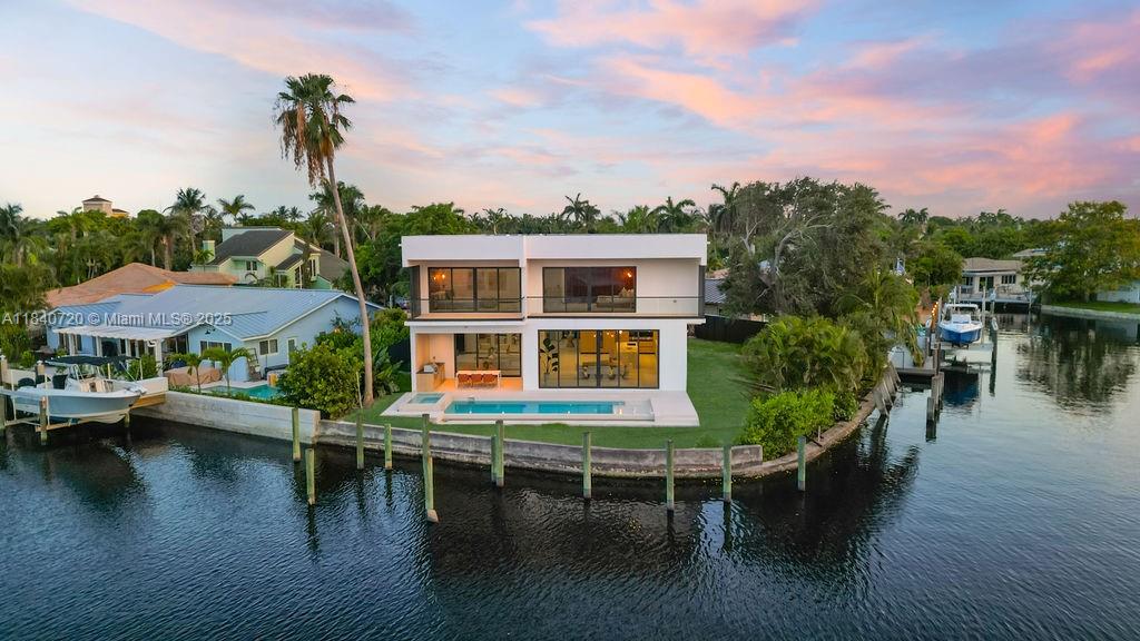 Modern luxury meets flawless design in this brand-new waterfront estate, built to impress at every turn. With 5 spacious bedrooms and 5.5 designer bathrooms, this residence blends timeless elegance with expert craftsmanship. The chef’s kitchen is a showpiece—dramatic Onyx walls, sleek LED lighting, high-end appliances, and generous storage offer both function and style. The expansive living area features premium finishes and floor-to-ceiling windows, creating a seamless indoor-outdoor feel. Right outside is 140 feet of direct waterfrontage, with a new seawall and custom deck. A 10x40 ft heated infinity pool and jacuzzi, complete with a summer kitchen, built-in speakers, and full security system. Built for luxury, designed for lifestyle—no detail overlooked.
Owner financing available.