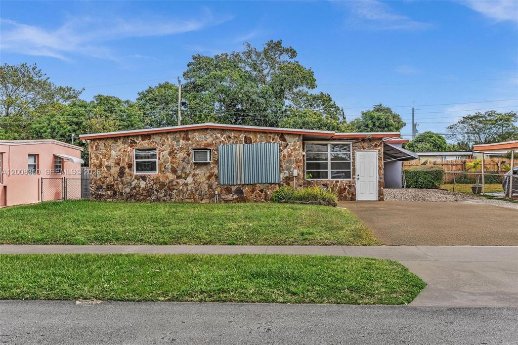 Photo of 1824 NW 25th Ave, Fort Lauderdale, FL 33311 (MLS # A12008350)