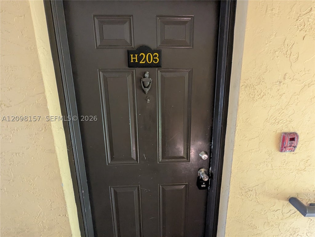 Photo of 4055 W Mcnab Rd #H203, Pompano Beach, FL 33069 (MLS # A12098157)