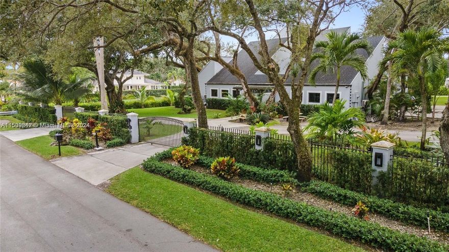From the elegant foyer leading into the spacious living areas and high ceilings to the large windows and exquisite finishes throughout, this property offers a blend of sophistication and comfort. The gourmet kitchen is a chef's dream, with top-of-the-line appliances, custom cabinetry, and a center island perfect for entertaining. The primary suite offers a generous layout, a spa-like en-suite bathroom with a soaking tub and a walk-in closet. The other 5 bedrooms and 5-and-a-half bathrooms provide ample space for family and guests. Discover a private oasis, with a beautifully landscaped yard, a sparkling pool, and a covered patio ideal for al fresco dining and relaxation. With meticulous attention to detail at every turn, you'll enjoy living in one of Miami's most prestigious neighborhoods.