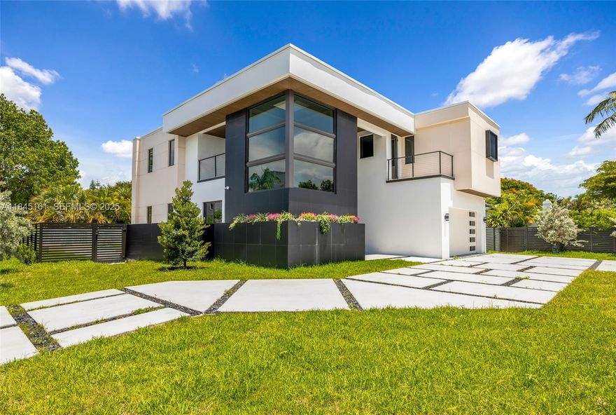 Spectacular brand-new construction offering 3,184 sq ft of refined living and 5,224 sq ft total in Victoria Park. This 5-bed /4.5-bath modern estate features a glass bridge connecting both wings, soaring ceilings, polished porcelain floors, and floor-to-ceiling impact glass. Gourmet kitchen with custom cabinetry, quartz waterfall counters, premium Jen Air appliances, and Liebherr wine fridge. Spacious master suite with oversized walk-in closet and spa-style bath. First-floor office opens to a private “secret garden” balcony. Backyard oasis boasts a pool with a jacuzzi and waterfall, lush landscaping, and covered patio. Two skylights, floating stairway, butler pantry, and dimmable lighting throughout complete this exceptional residence designed for elevated living.