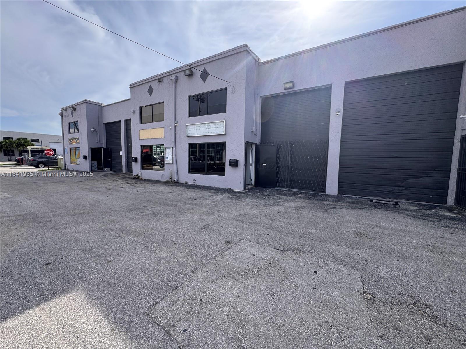 Exceptional flex warehouse space with two-story office, ideally located just off Palmetto Expressway and Okeechobee Rd. Approx. 1,437 sq. ft. of office space plus 360 sq. ft. mezzanine. Features include 100% central A/C, 18'2" ceiling height, 18'H x 10'2"W bay door, bathroom with shower, storage, server room, and conference area. Upstairs includes a spacious executive office. Alarm system in place. Unit is in excellent condition. Perfect for auto dealer, paint shop, wholesale, sign/print company, and more.