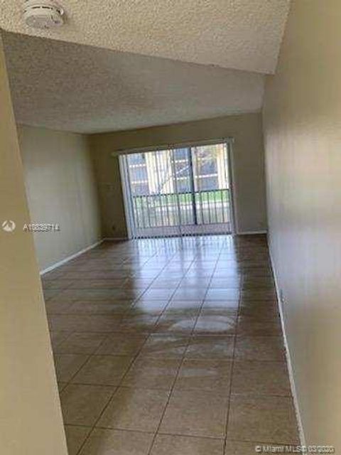 Photo of 7925 S Colony Cir S #207, Tamarac, FL 33321 (MLS # A10839714)
