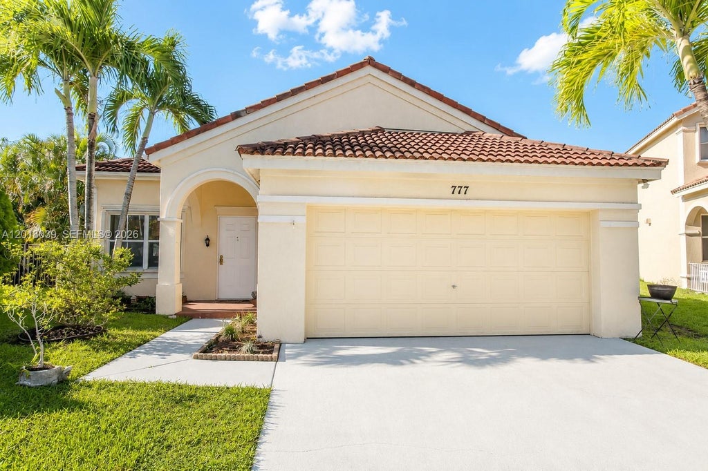 Photo of 777 Tanglewood Cir, Weston, FL 33327 (MLS # A12018039)