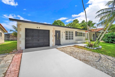 Photo of 5406 NW 23rd Ave, Tamarac, FL 33309 (MLS # A12105536)