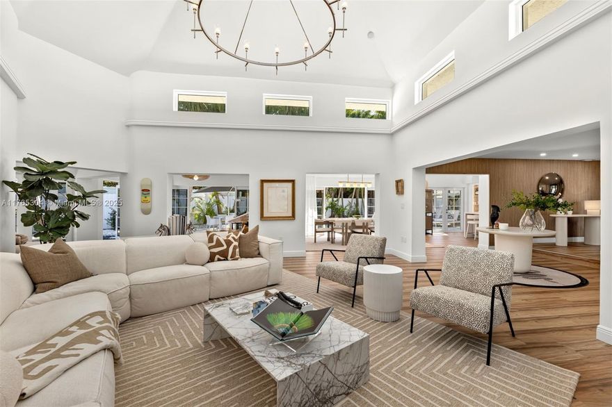 This home has the "WOW' factor! This spacious home on an oversize corner lot (9515 sq.ft)was meticulously remodeled and upgraded in the most beautiful style! 3962 sq.ft. of interior space. Sumptuous wallpapers, wood paneling at the entrance and so many gorgeous details! To see it is to love it! Vaulted ceilings including in the primary bedroom and living room! Beautifully fenced yard with different areas for kids, relaxation and pets! , heated pool, 3 separate AC zones. All impact glass throughout! Wood-look porcelain tile throughout Brand new kitchen! Brand new front door! Brand new driveway and fence! EV charging unit! Automatic exterior lighting!
Beach Club membership included!