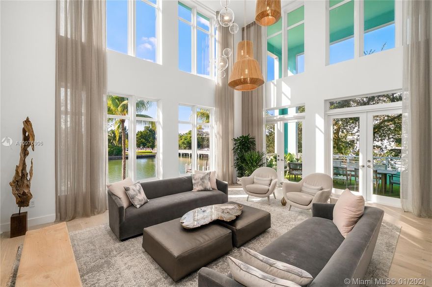 Enter this meticulously renovated, rarely available  5BD/5+1BA waterfront AQUA townhome.  Enjoy full water views in a living room with 20ft soaring ceilings & stunning floor-to-ceiling windows.  Fully equipped kitchen w/ impeccable wood & marble finishes, natural light and cozy breakfast nook. Exquisite finishes & bleached oak flooring throughout. Private master bedroom w/ enormous closets and spa bathroom w/teak & natural stone finishes, dual sinks, & soaking tub within a glass encased shower.  A custom white oak clad movie room,  gym, wet bar, & and five oversized rooftop decks with views of the Miami skyline as well as Lutron lighting throughout, Control 4, Nest thermostat and August locks complete this spectacular home.