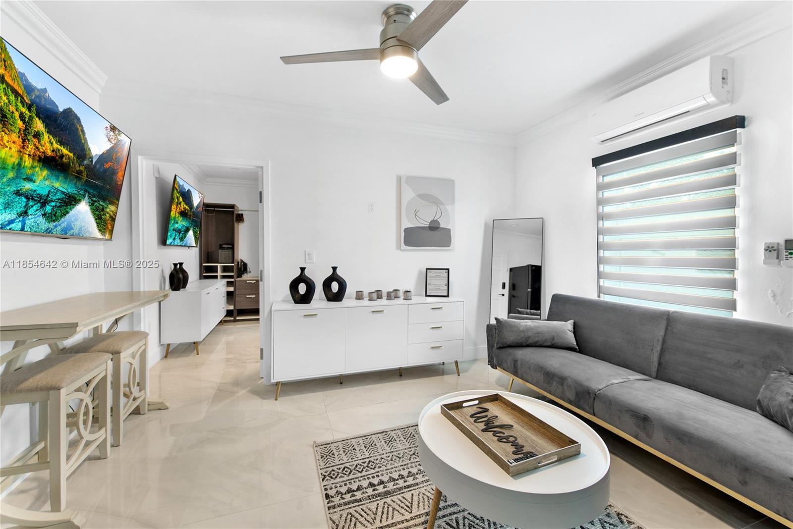 Discover this fully furnished and equipped apartment, ready for you to move in. Located at Mile Marker 98 in Tavernier, this unit offers an unbeatable location with direct exposure on the Overseas Highway. The building recently underwent over $100,000 in furnitures, including brand-new appliances and top on the line equipment in each unit. The building is a hub of activity, with popular businesses like a hair and nail salon, a pizzeria, and a doctor's office. A food truck and ice cream shop are also coming soon, attracting plenty of foot and car traffic.