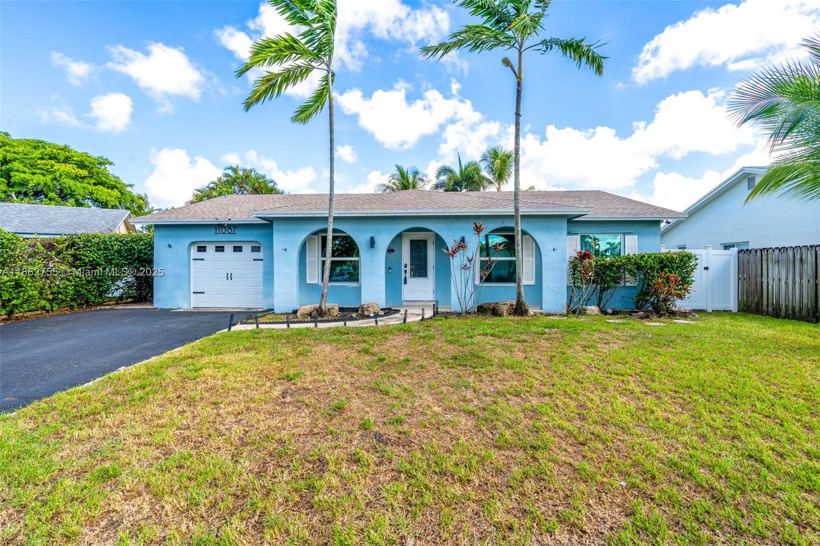 4-bed, 2-bath home with pool, tiki hut, new roof, and impact windows. Open floor plan, renovated kitchen, and large backyard for entertaining. Near Sawgrass Mills Mall, top schools, parks, and dining. Ideal family-friendly home combining comfort, style, and convenience.