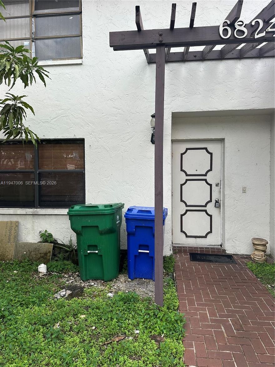 Investor/Handyman Opportunity! Townhome located in the desirable Woodscape community in Miramar. This property needs updating but offers excellent potential for renovation and equity upside. Features a large concrete patio, ideal for outdoor entertaining or future enhancements. Community amenities include pool and tennis courts. Conveniently situated on County Line Road between Miramar Parkway and County Line, within walking distance to Perry Elementary, close to shopping, dining, and with easy access to the Turnpike. Perfect opportunity for investors or buyers looking to customize and add value.