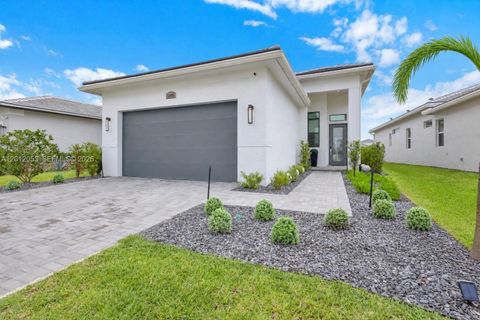 Photo of 12496 SW Lunata Way, Port St Lucie, FL 34987 (MLS # A12012053)