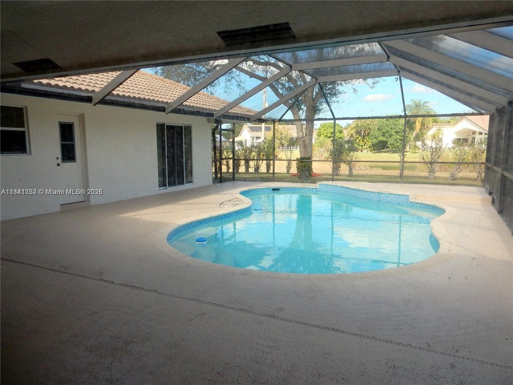 Photo of 9791 NW 47th Dr, Coral Springs, FL 33076 (MLS # A11841152)